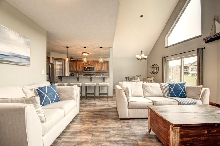 Open living area with a couch, love seat, Smart TV, and Blu-Ray Player
