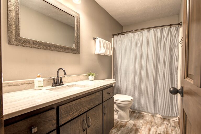 The full bathroom upstairs includes a bathtub + shower and plenty of hooks to hang towels.
