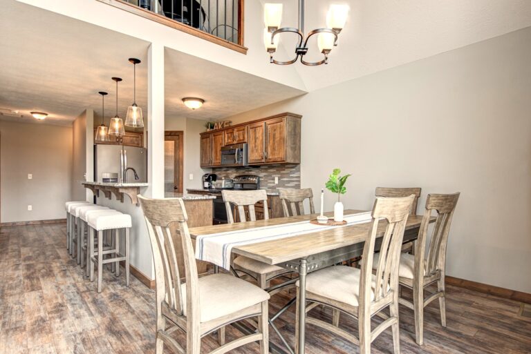 The spacious dining table seats up to 10 people (additional leaves and folding chairs available in the hall closet) and the island seats 4 people.