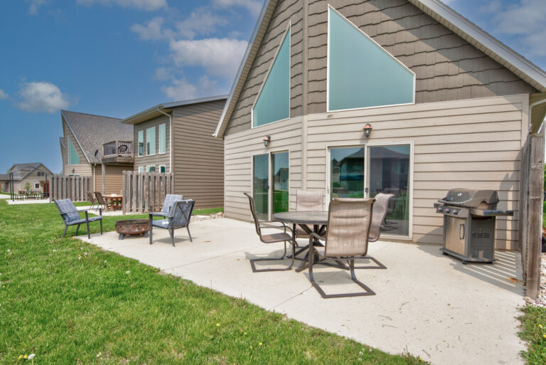 The patio includes a Weber grill, propane, grilling utensils, patio table + chairs, fire pit, smores sticks, and pie irons. The perfect way to unwind after a day on the water.
